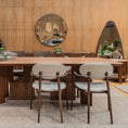 Load image into Gallery viewer, Dining area with wooden table and chairs in a room with wooden walls and mirrors.
