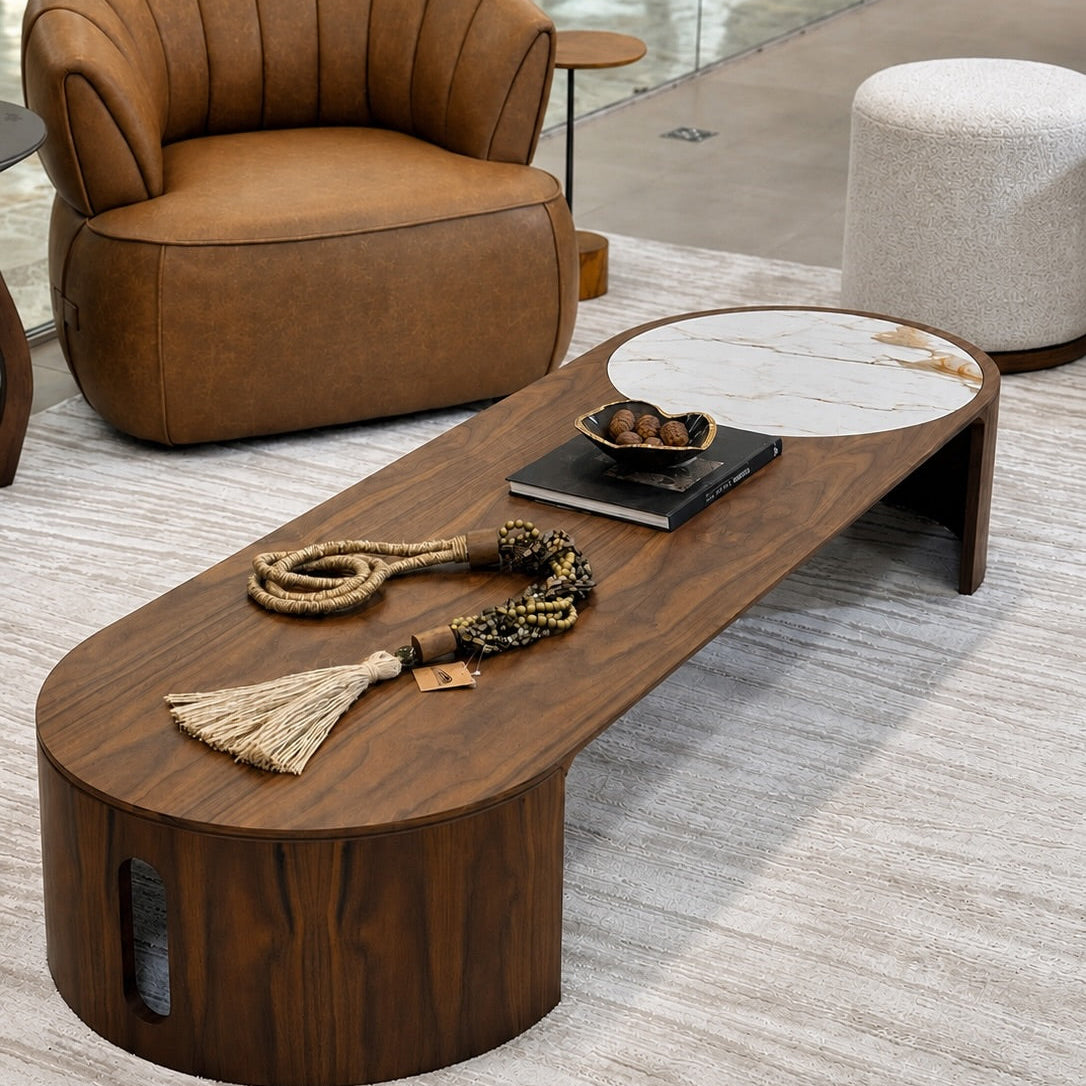 Brown leather armchair and wooden coffee table in a modern interior setting