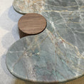 Load image into Gallery viewer, Marble table with wooden base on a neutral background
