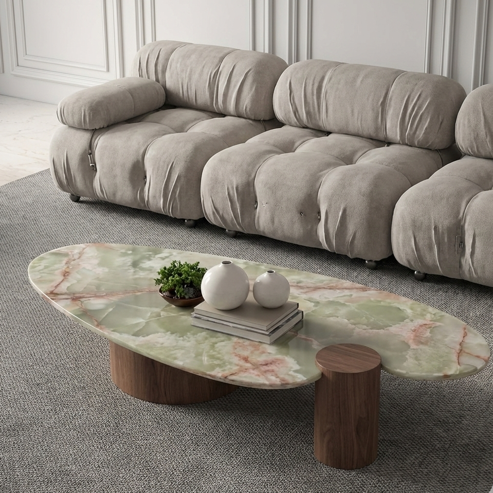 Beige sofa in a room with a marble coffee table and decorative items.