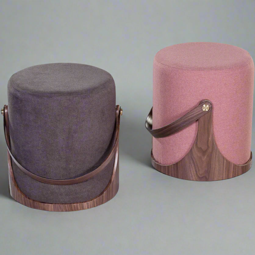 Two cylindrical ottomans with wooden bases on a white background