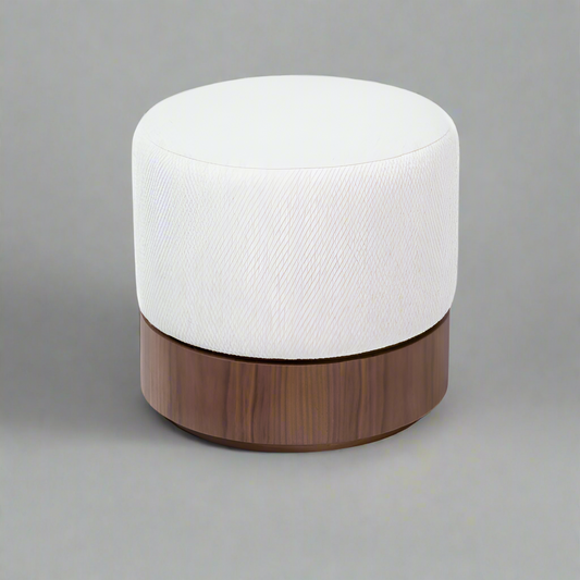 White cushioned ottoman with a wooden base on a white background