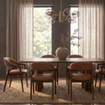 Load image into Gallery viewer, A modern dining room setup featuring a rectangular wooden table with six upholstered chairs in brown leather, set on a textured area rug. The room is styled with sheer curtains, a multi-light chandelier, and a central vase with greenery.
