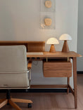 Charger l'image dans la visionneuse de la galerie, Wooden desk with two lamps and a chair in a room.
