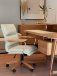 Charger l'image dans la visionneuse de la galerie, Beige office chair in front of a wooden desk with a neutral background

