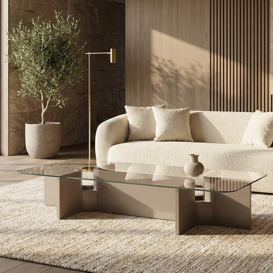 Modern living room with a beige sofa, coffee table, and decorative elements.